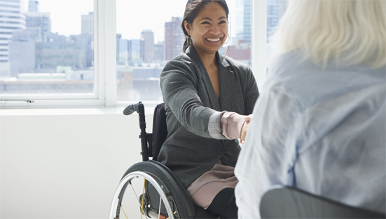 Woman in wheelchair, meeting people