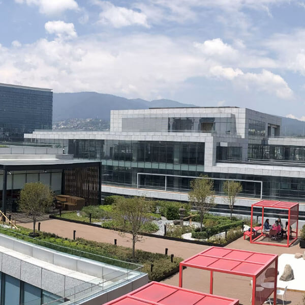 Courtyard of Takeda building complex with mountains in the distance