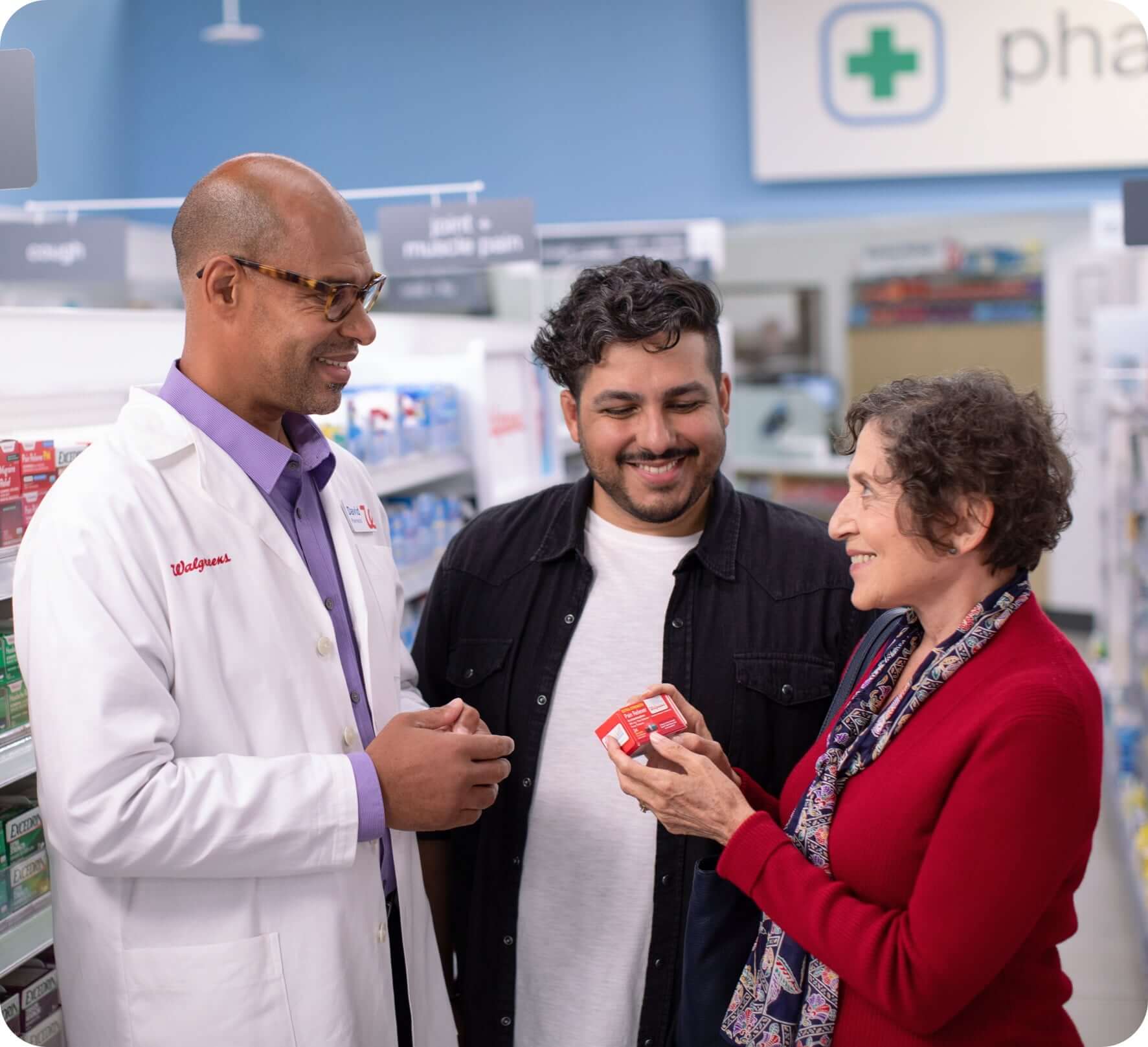 Walgreens pharmacist assisting in-store customers