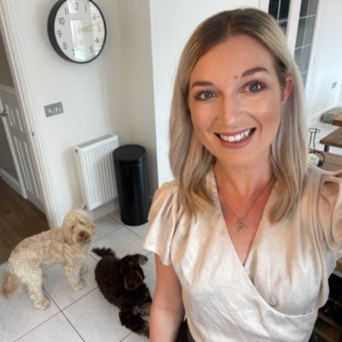 a photo of sam with her two dogs