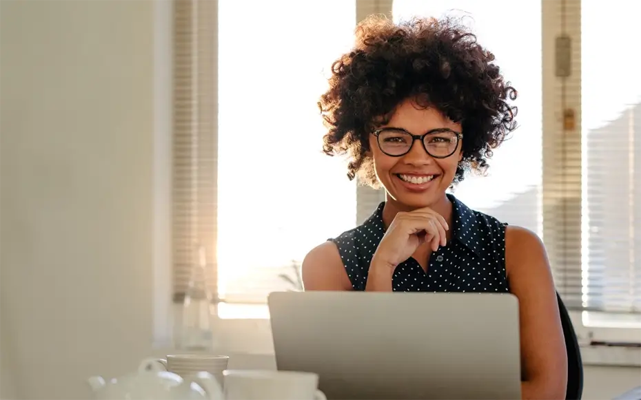 Woman sitting at desk and smiling