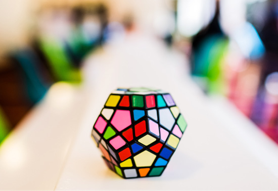 A multi-color mosaic sitting on a confrerence room table.