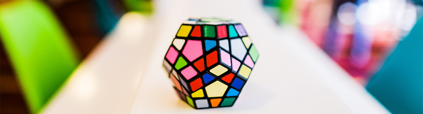 A multi-color mosaic sitting on a confrerence room table.