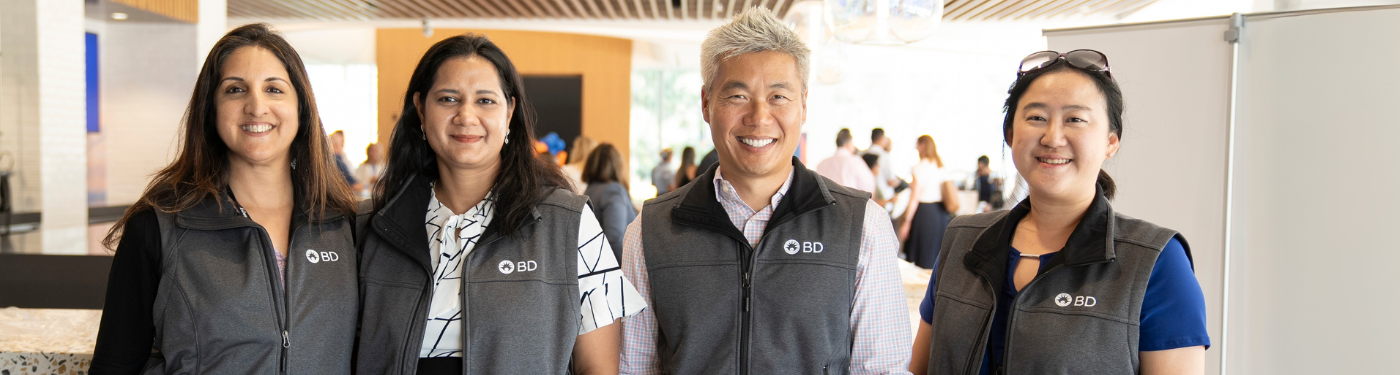 Four BD associates smiling
