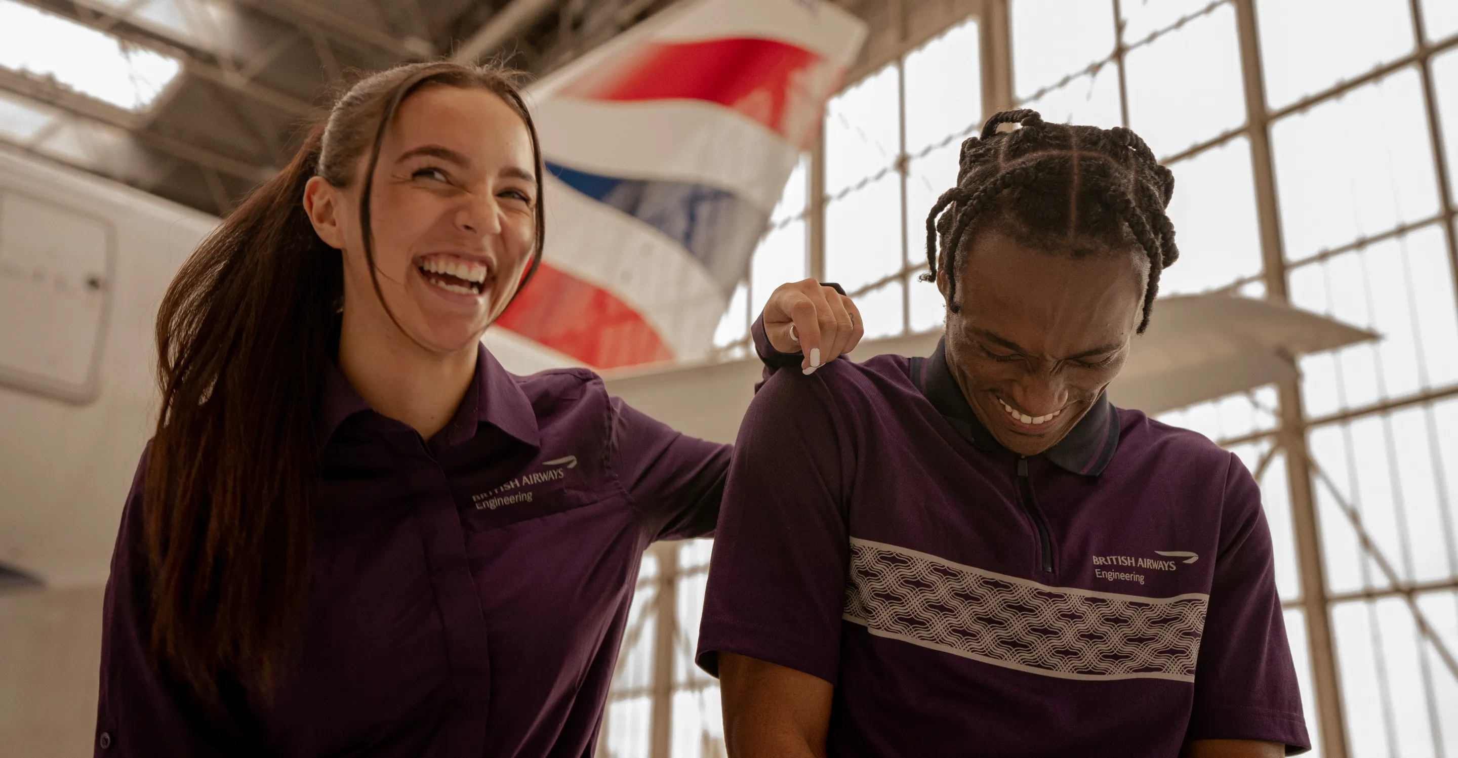 Two British Airways workers laughing