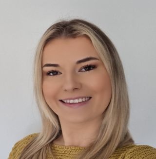 girl with blonde hair smiling