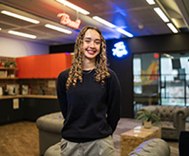 Smiling woman standing in modern office space