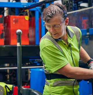Warehouse worker in high visibility.
