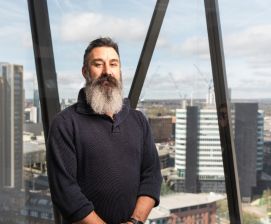 man with city view behind