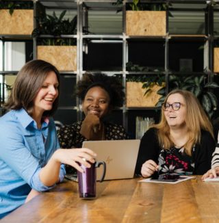 Group of women laughing.