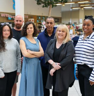 group of people smiling towards camera