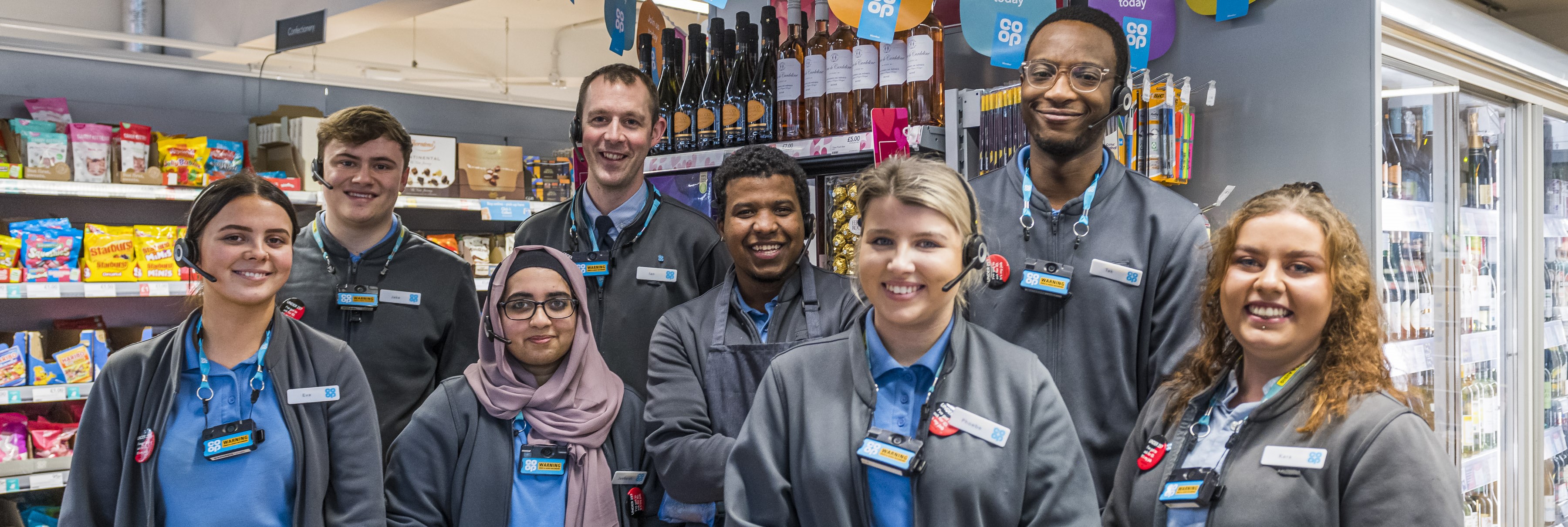 A group of employees standing on the shop floor