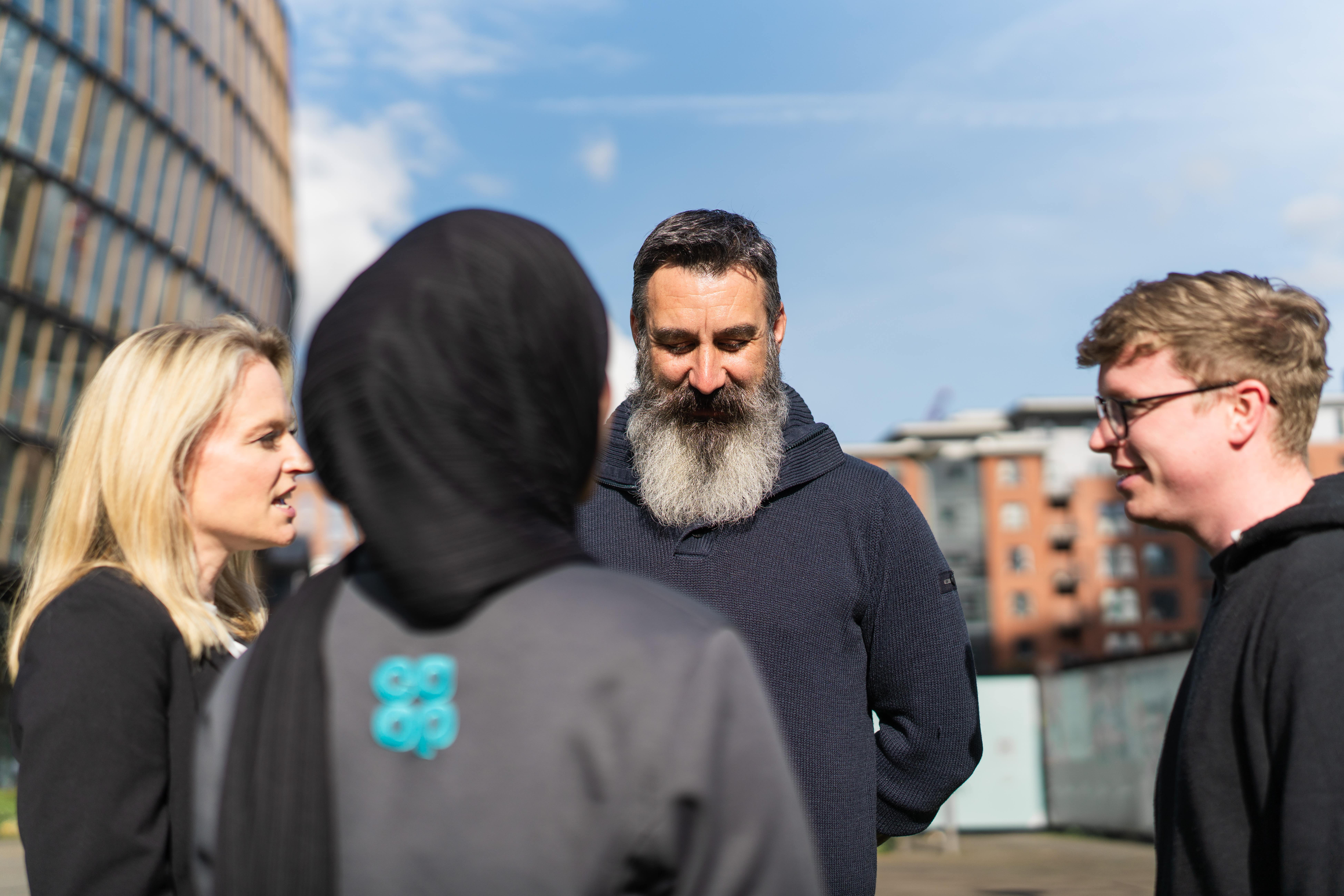 Colleagues having a discussion outside
