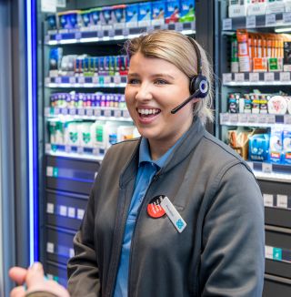 woman smiling in shop.