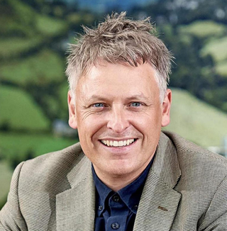 man in suit smiling at camera