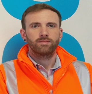 Man in orange jacket at Co-op Biggleswade site.