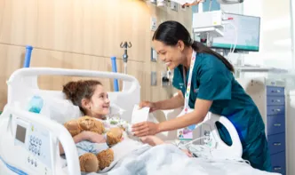 nurse comforting a sick child