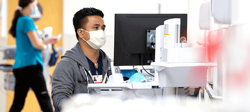 A man working on medical equipment