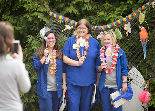 Nurses having fun at a luau-themed party