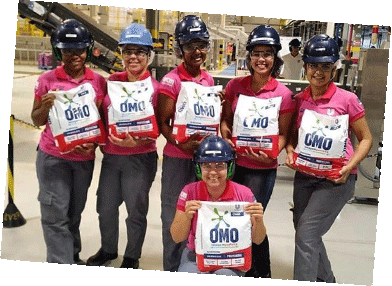 Factory workers pose for a group photo