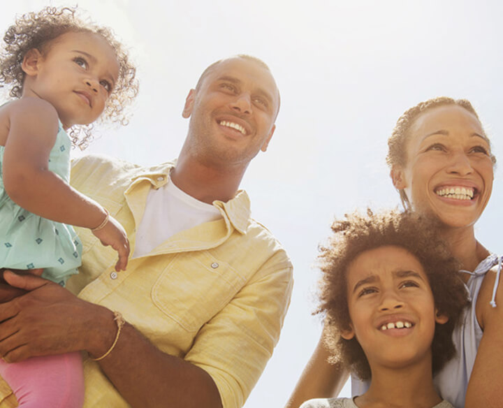 family of four in the sun