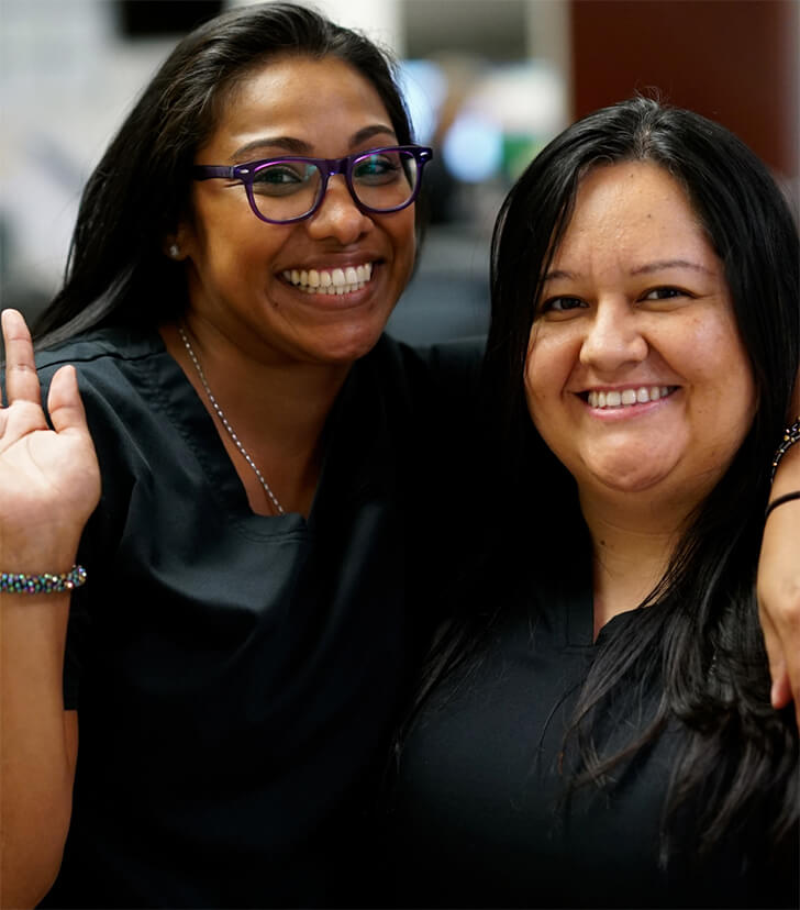 Two people smiling for the camera