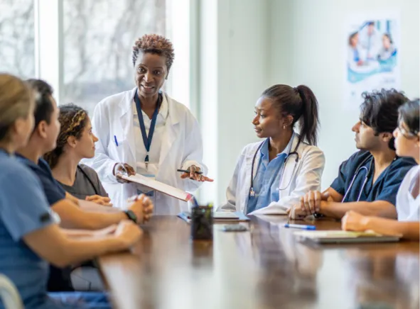 Physicians talking at a table
