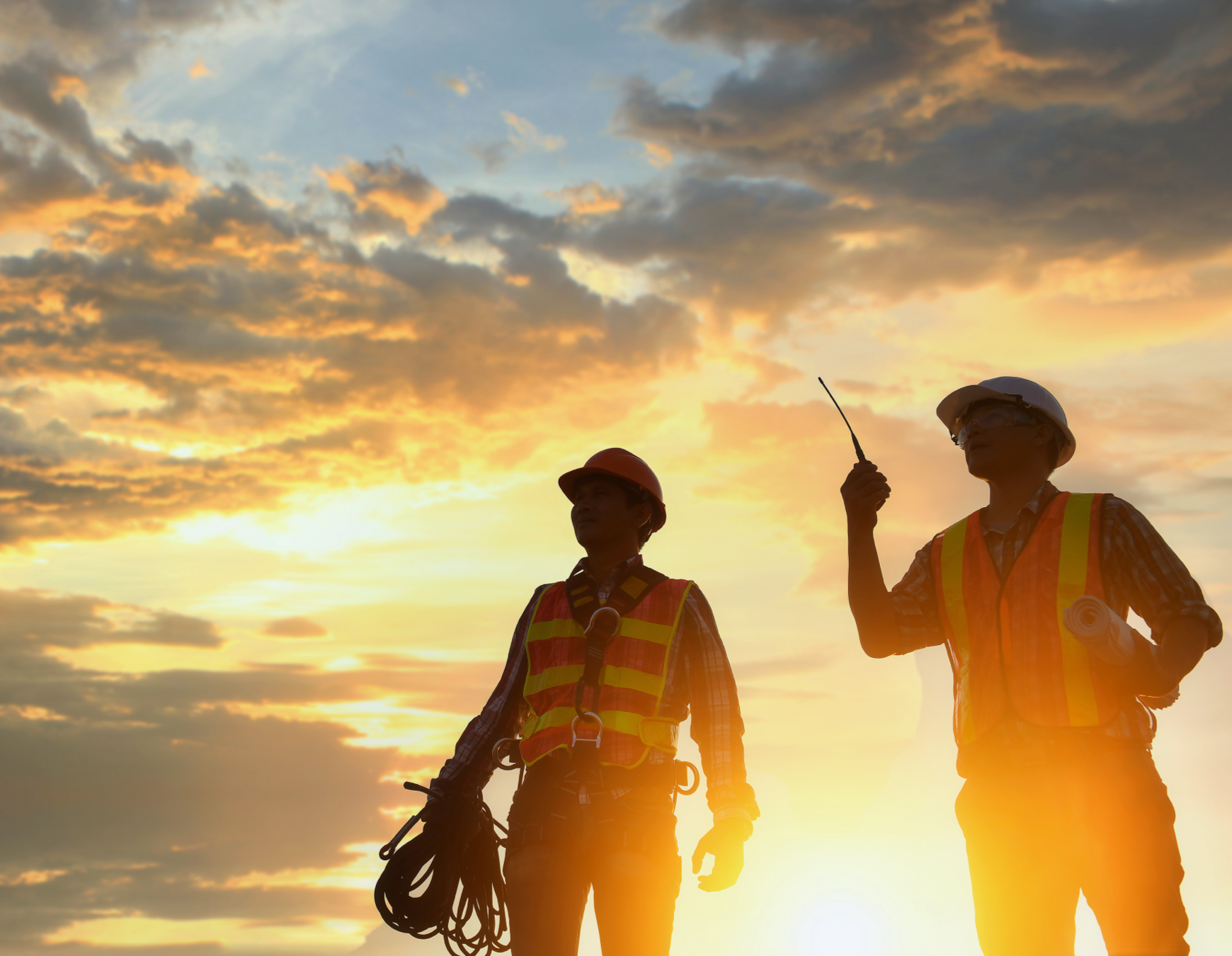 two working at sunset