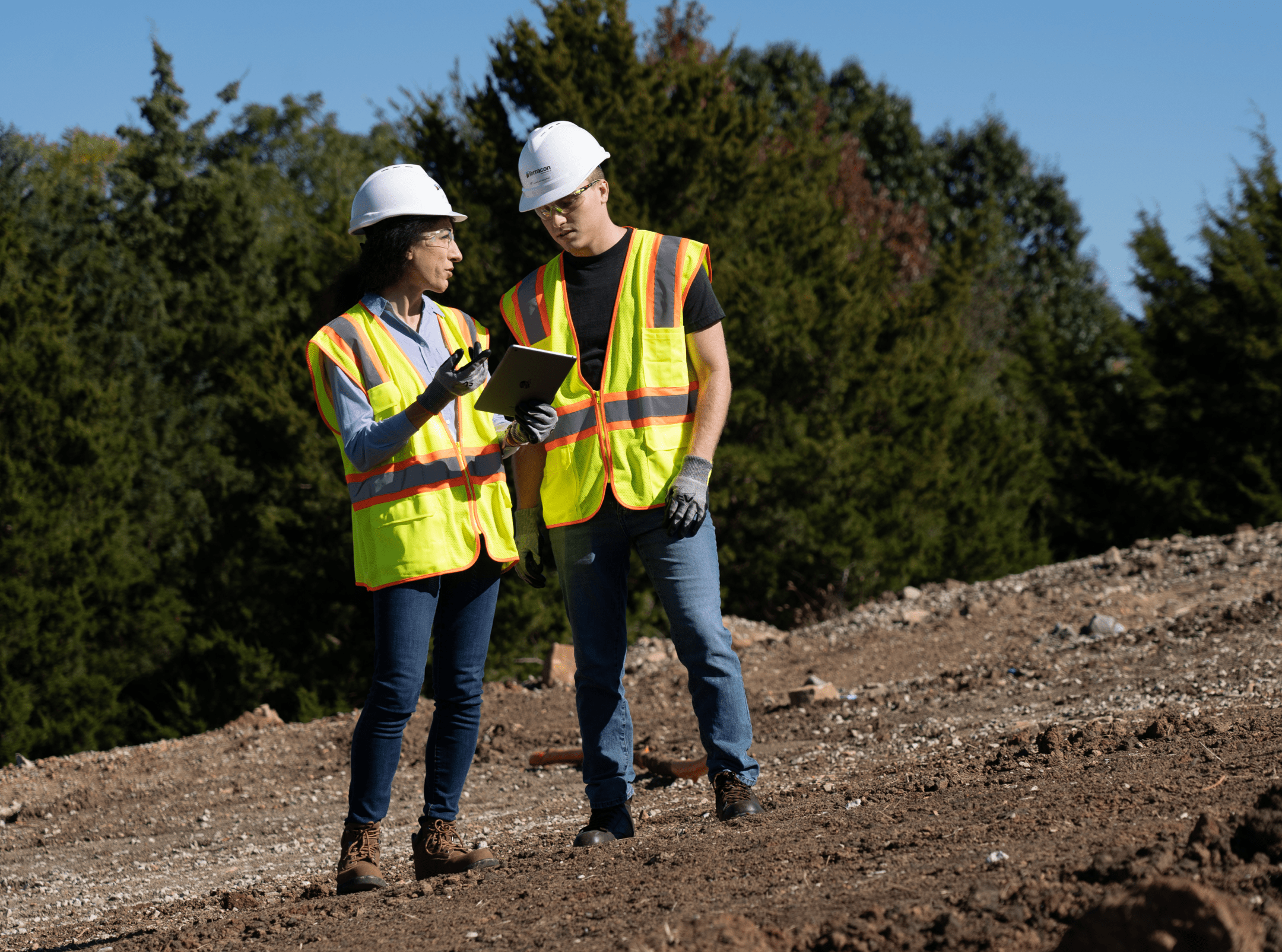 two workers in field