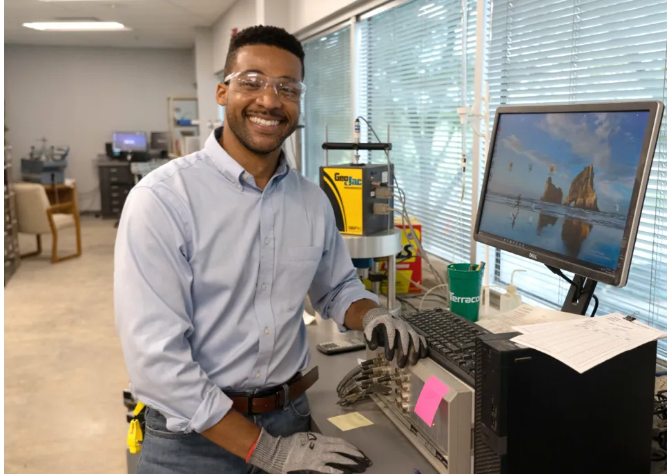 Man smiling while working in computer