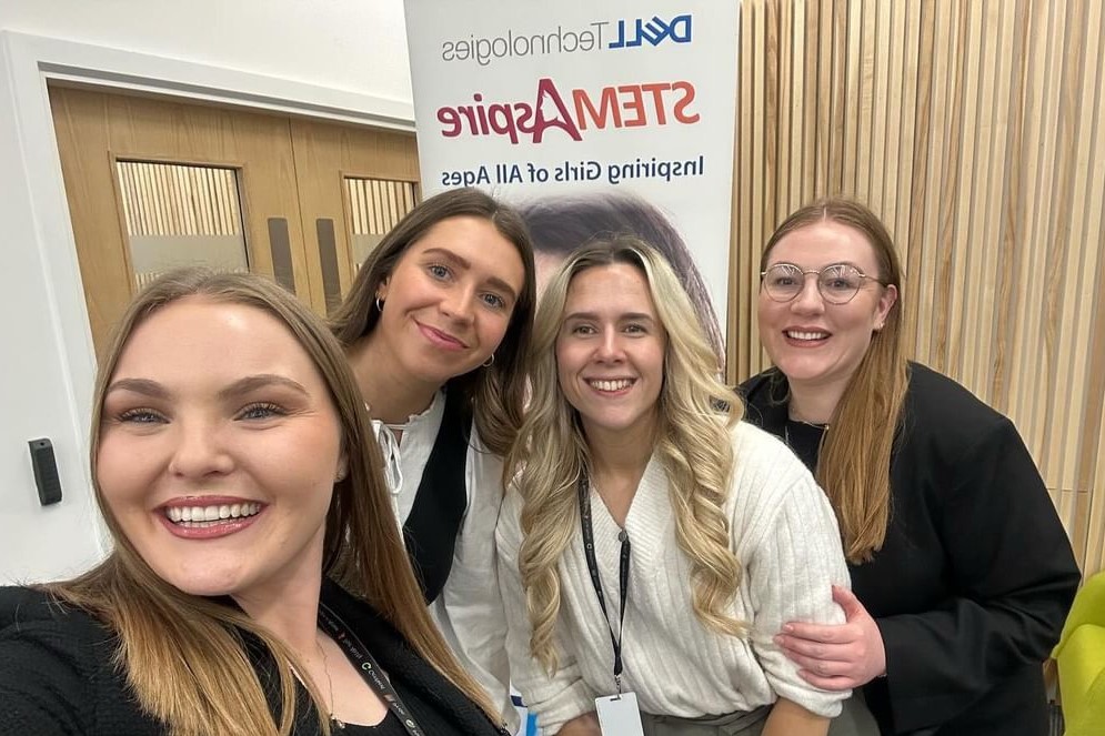 Izzy with a group of coworkers at a STEM Aspire event.