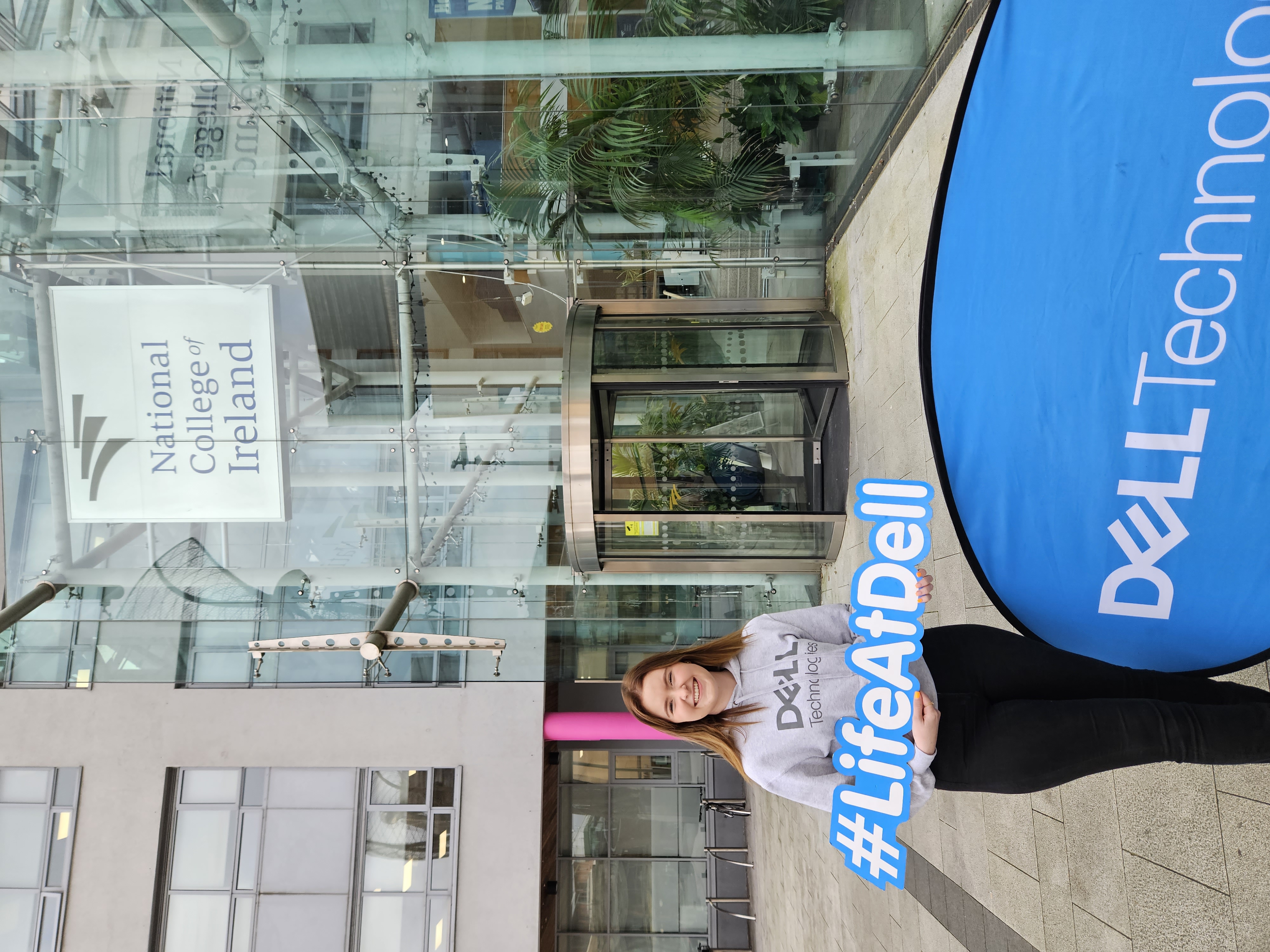 Niamh outside the National College of Ireland holding a #LifeAtDell sign.