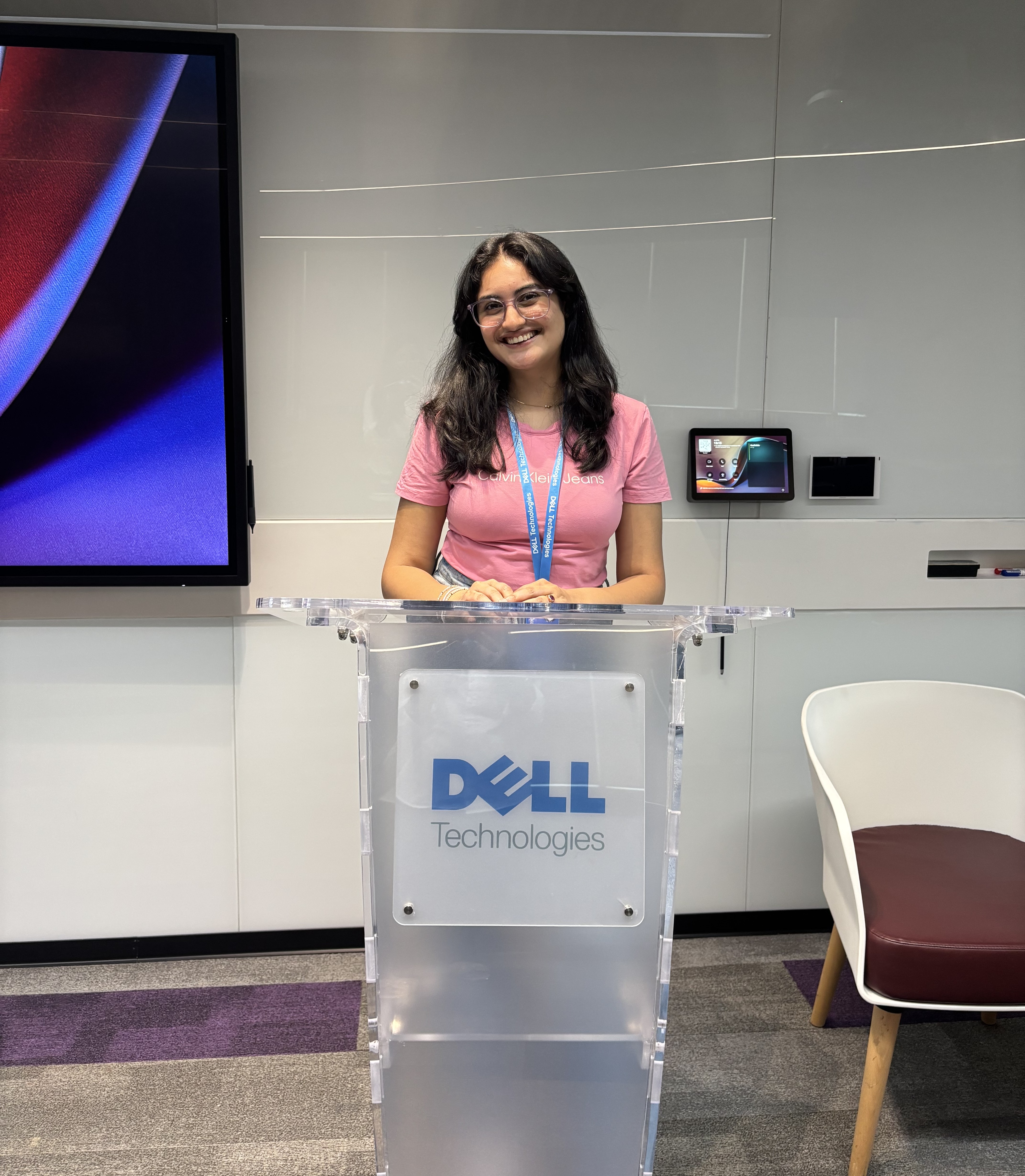 Niharika standing at a Dell podium to present