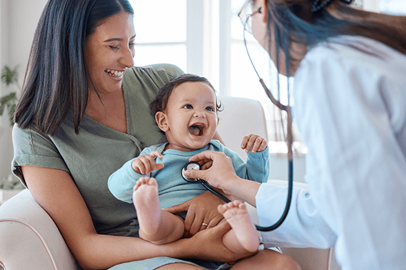 Laughing mother and child with doctor
