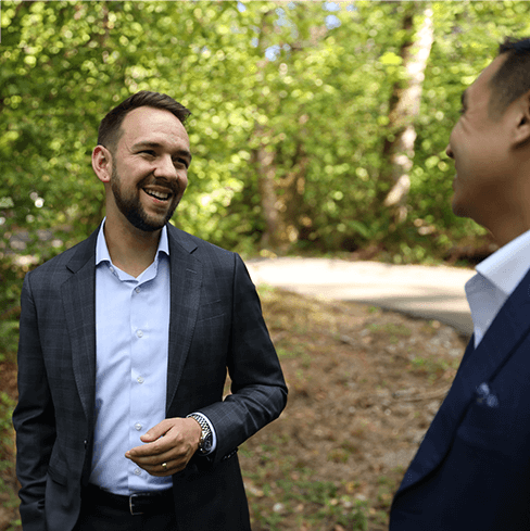 Two men in conversation, in a park