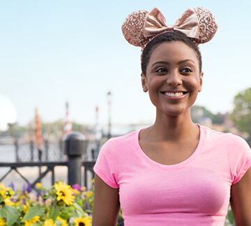 Girl with large bow in hair is smiling