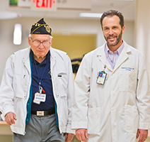 Doctor and patient walking down a hall