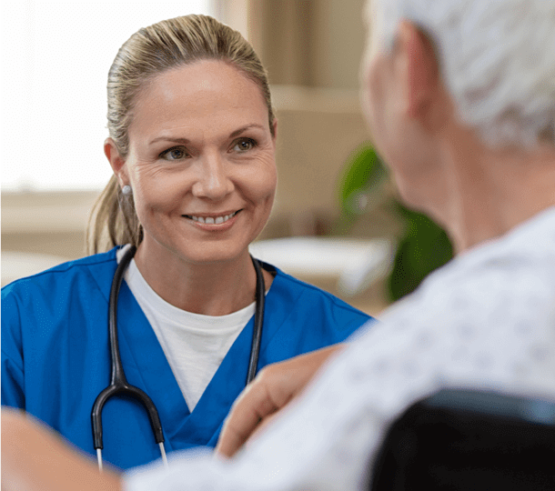Nurse smiling at elderly patient