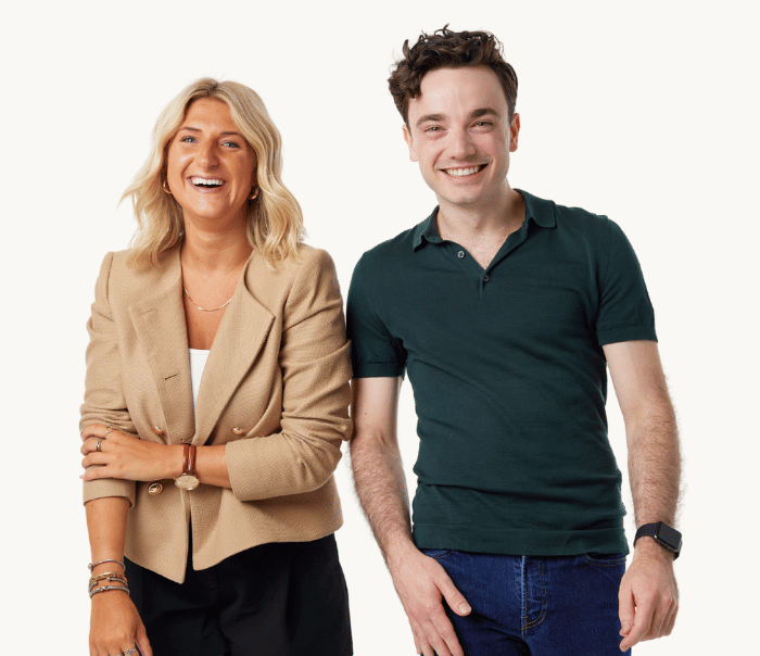Two associates standing next to each other.