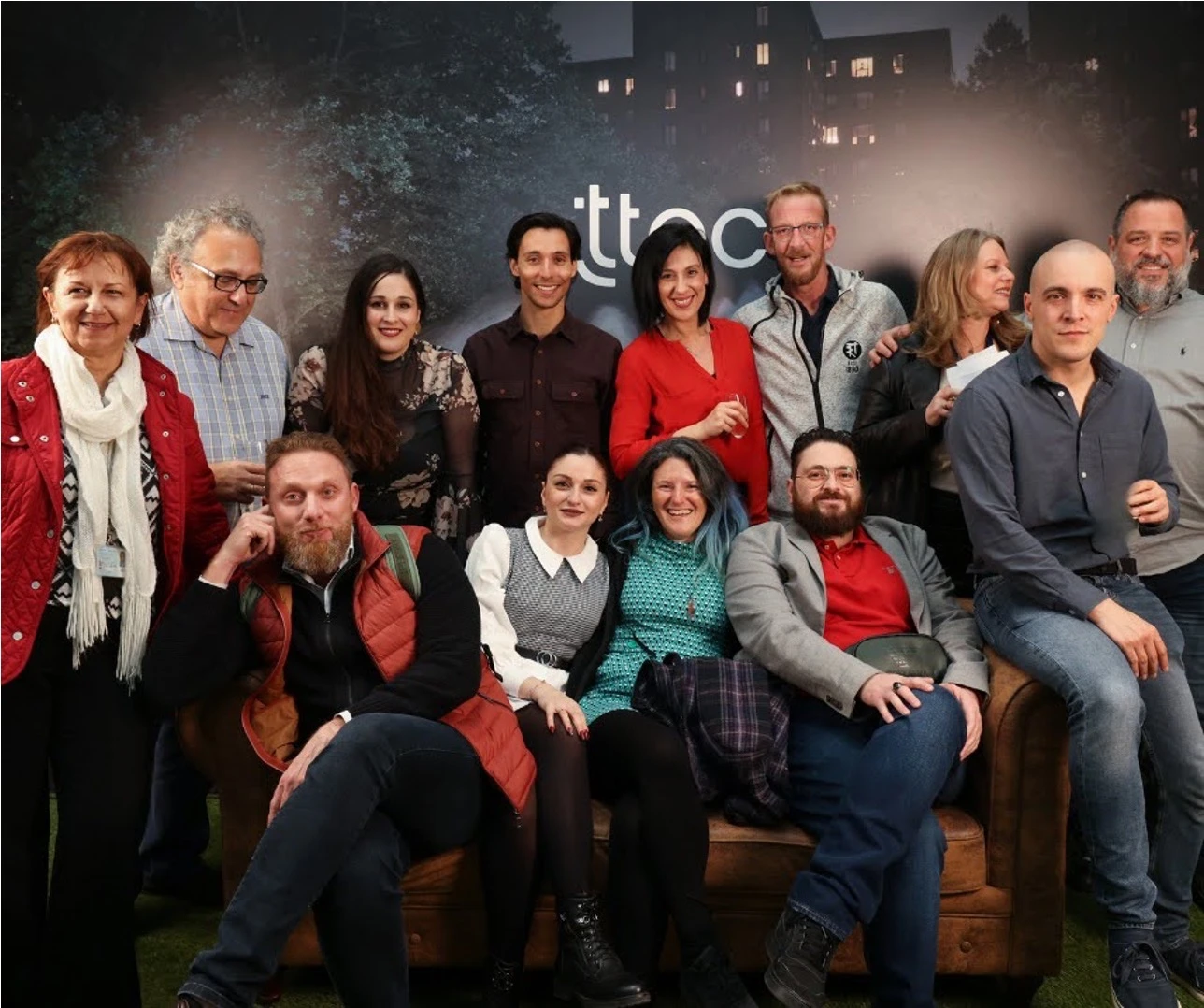 Happy TTEC employee in a group picture