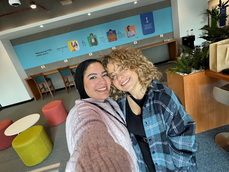 Two TTEC Egypt employees taking a picture together