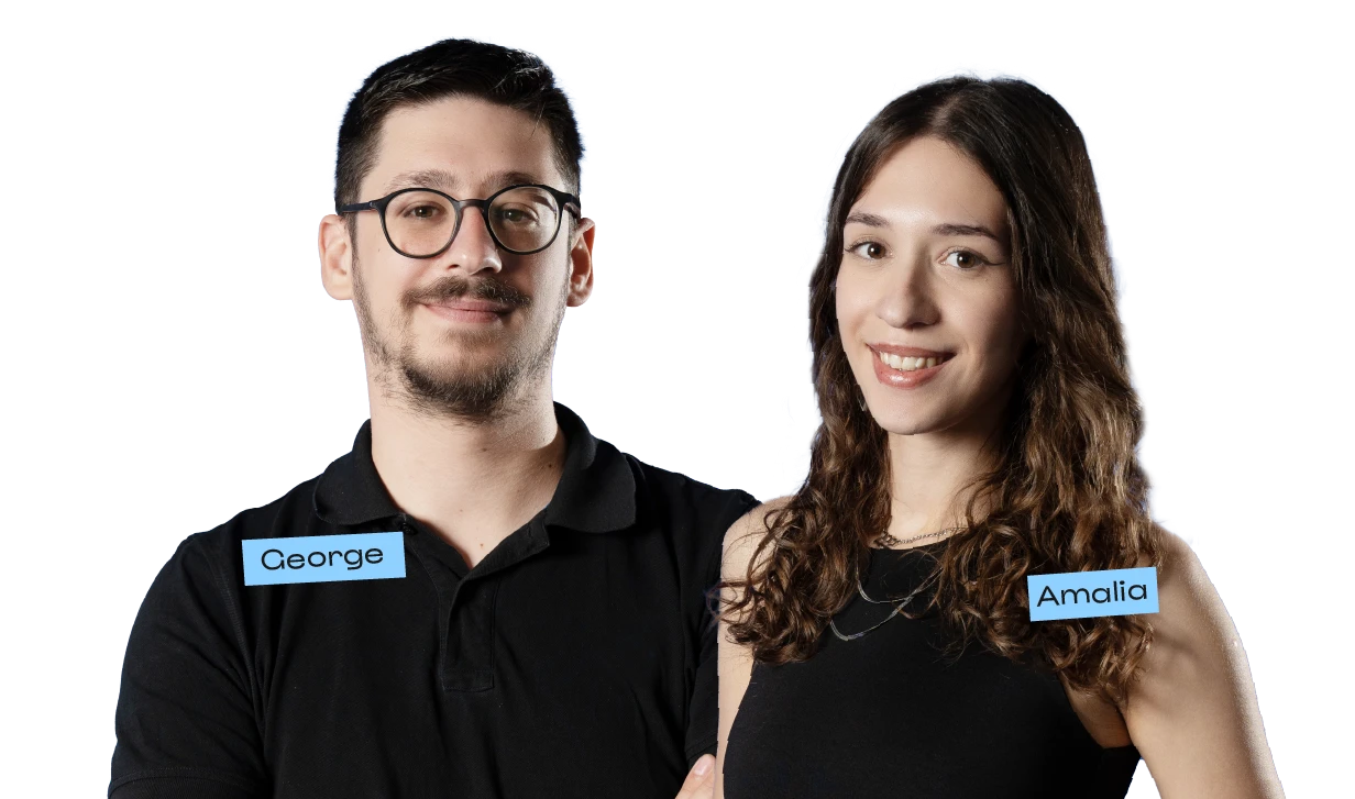 Two coworkers smiling at the camera