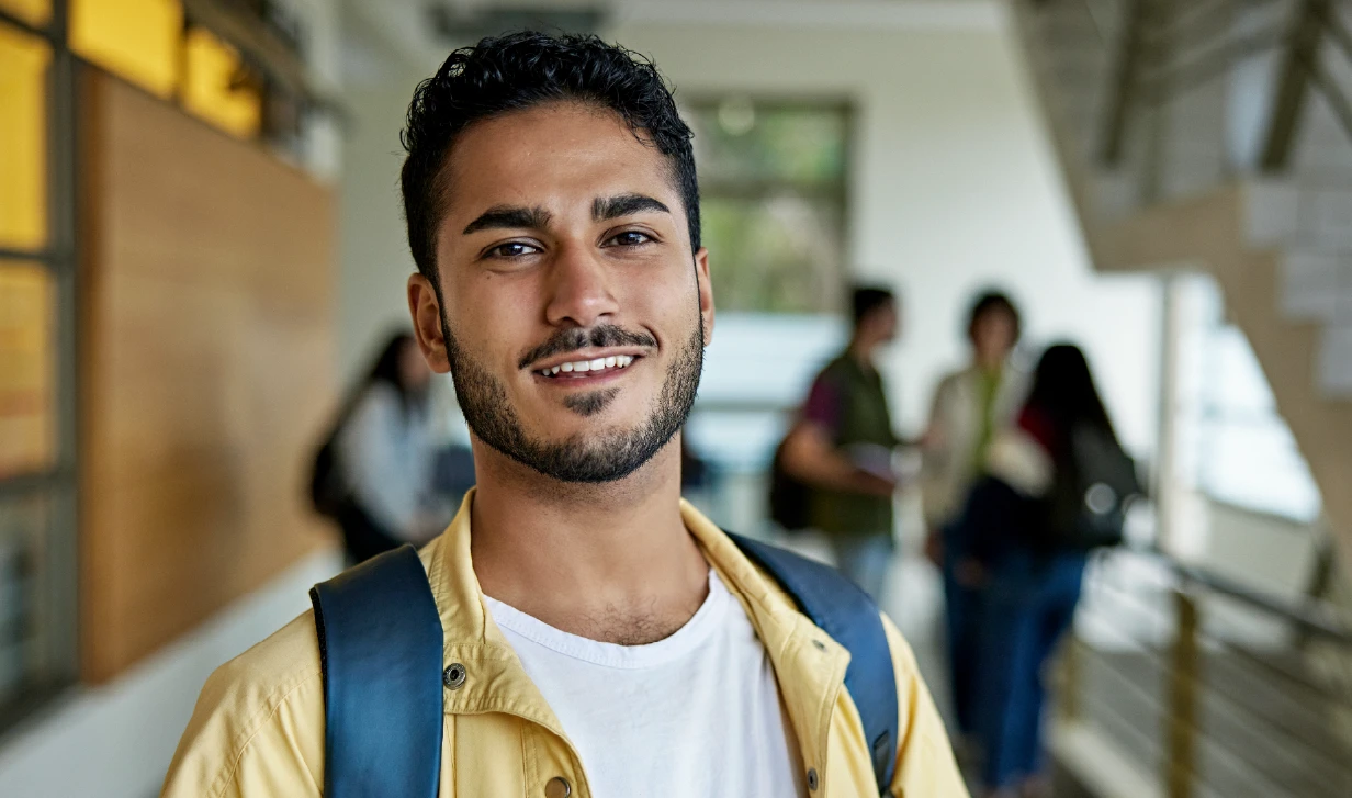 Image of student in campus hallway
