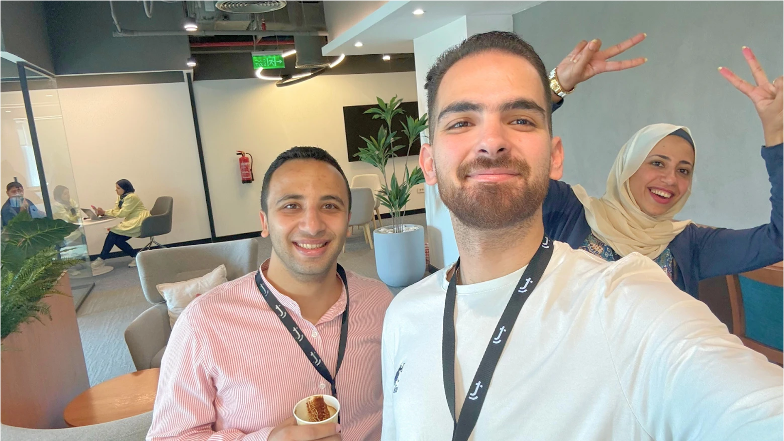 Happy team members taking a fun selfie picture.