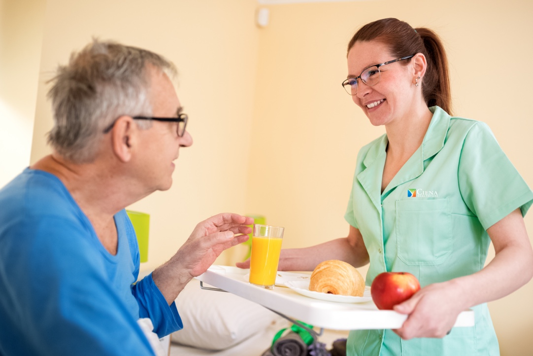 Ciena Dietician serving a patient.