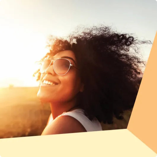 woman smiling at the sunset