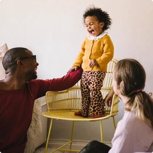 Parents playing with their child