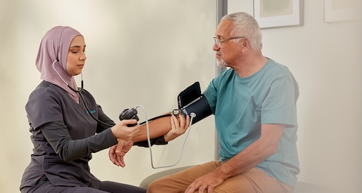 medical assistant taking a patient's vitals