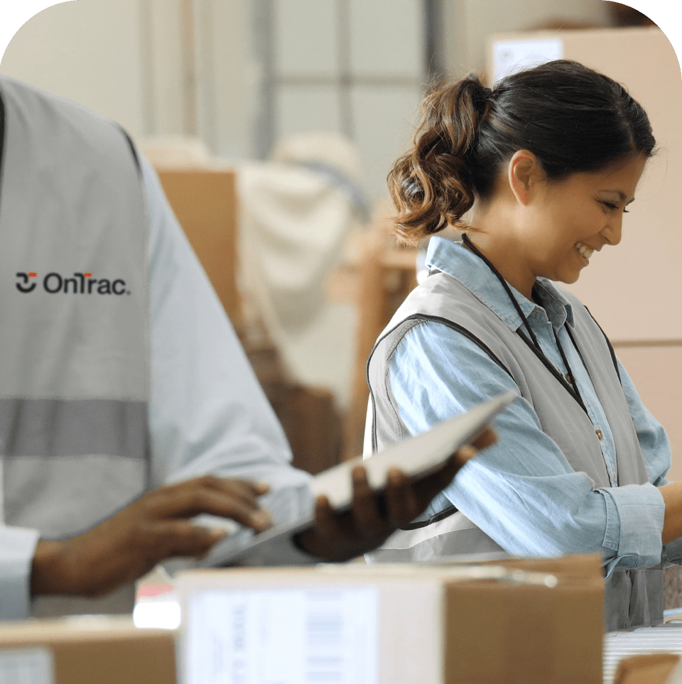 Vans at a OnTrac docking bay