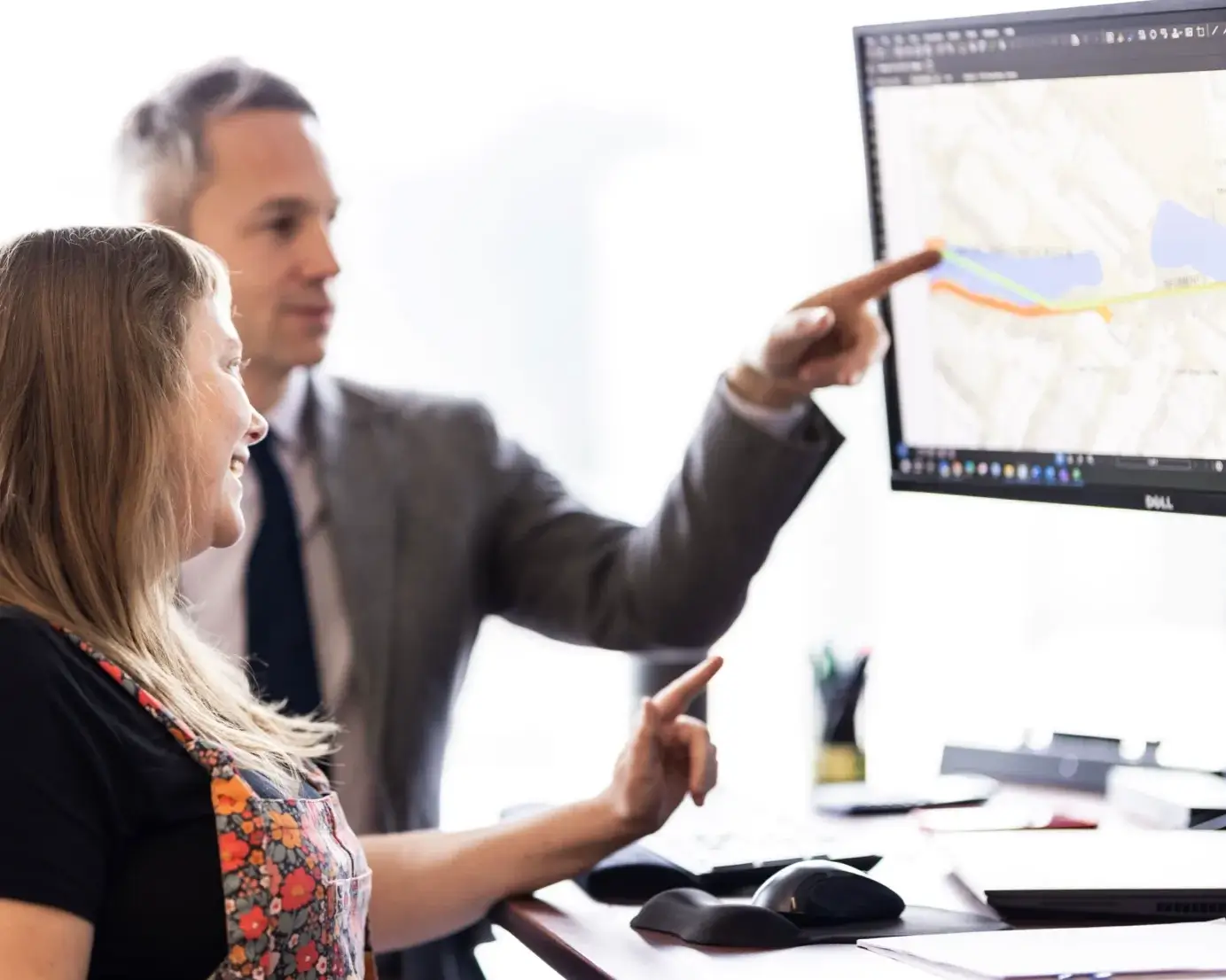 Employees looking at the computer screen